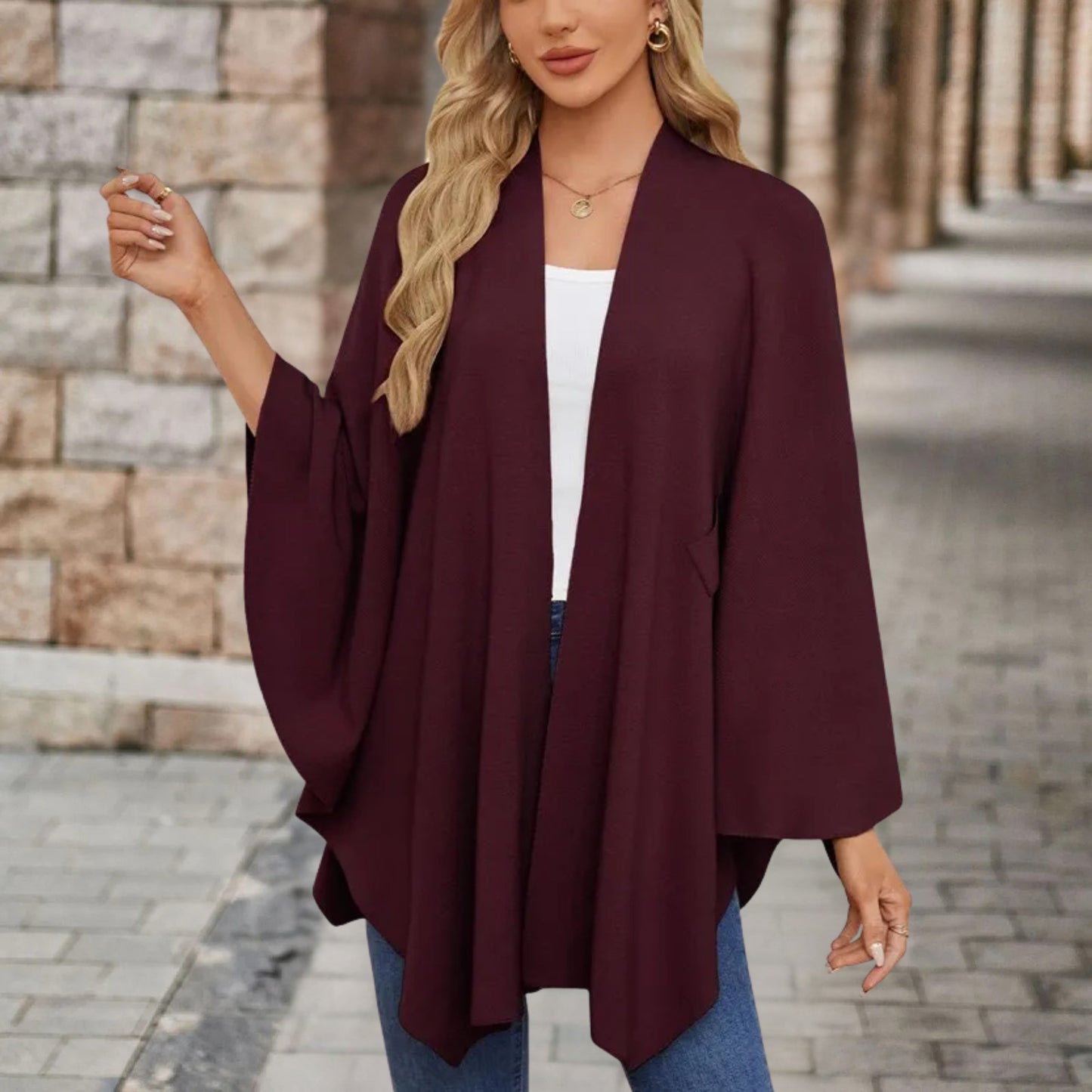Blusa con capa con nudo frontal